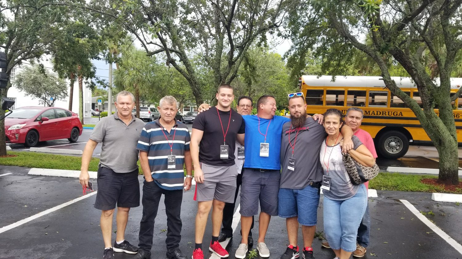 The Madruga family drivers standing in front of their school buses in Hialeah, Florida